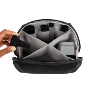 Open smell-proof stash bag showing multiple compartments neatly storing smoking accessories.